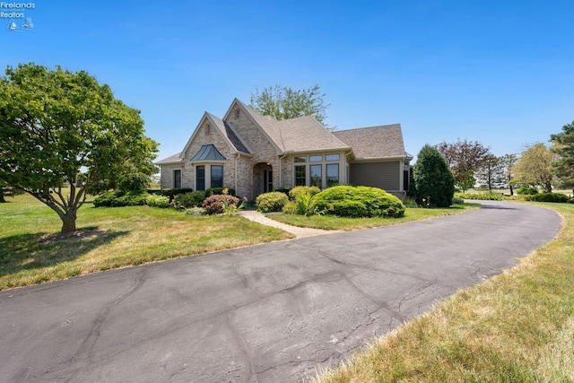 view of front of home with a front lawn