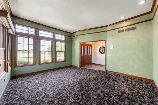 unfurnished room featuring carpet flooring, crown molding, and a textured ceiling