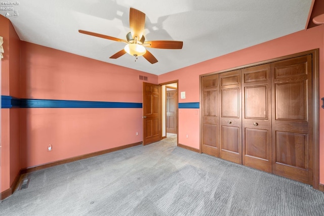 unfurnished bedroom with light carpet, a closet, and ceiling fan