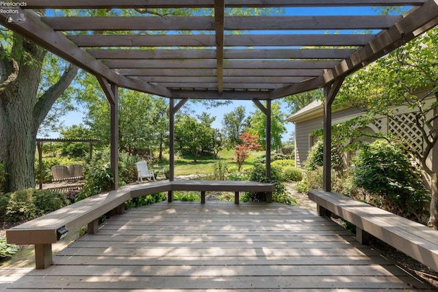 wooden deck featuring a pergola