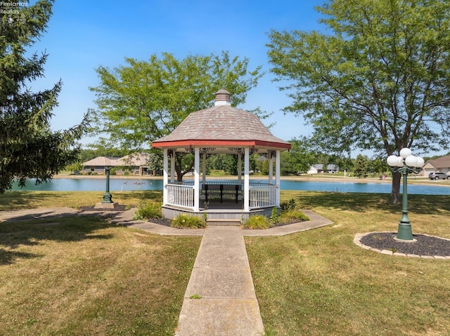 view of property's community featuring a gazebo, a yard, and a water view