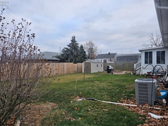 view of yard with a storage unit and cooling unit