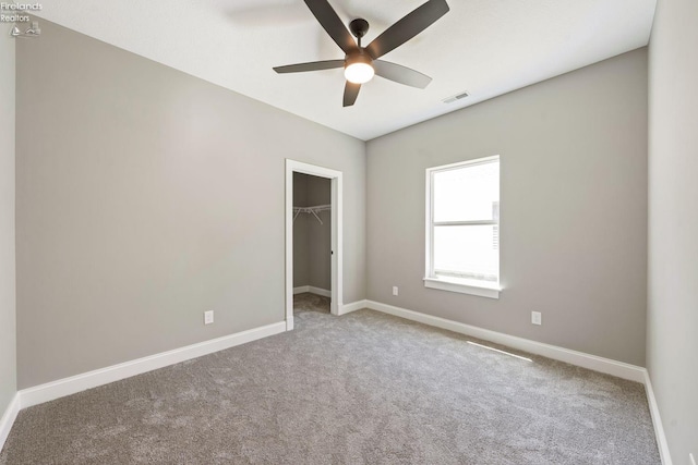 unfurnished bedroom featuring baseboards, visible vents, and carpet flooring