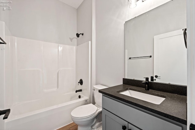 full bath with tub / shower combination, vanity, and toilet