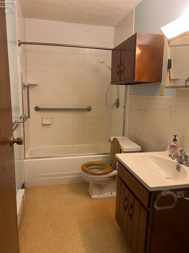 full bathroom with backsplash, a textured ceiling, toilet, vanity, and tiled shower / bath