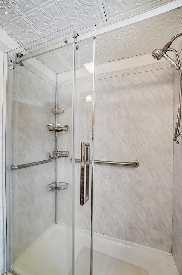 bathroom with shower / bath combination with glass door