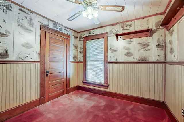 entryway with ceiling fan and carpet floors