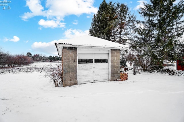 view of snow covered garage