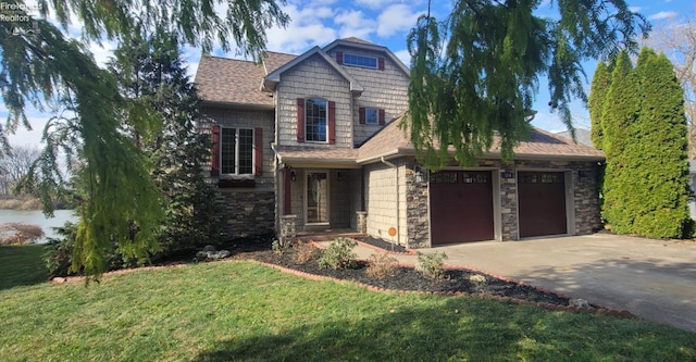 craftsman inspired home with a front yard and a garage