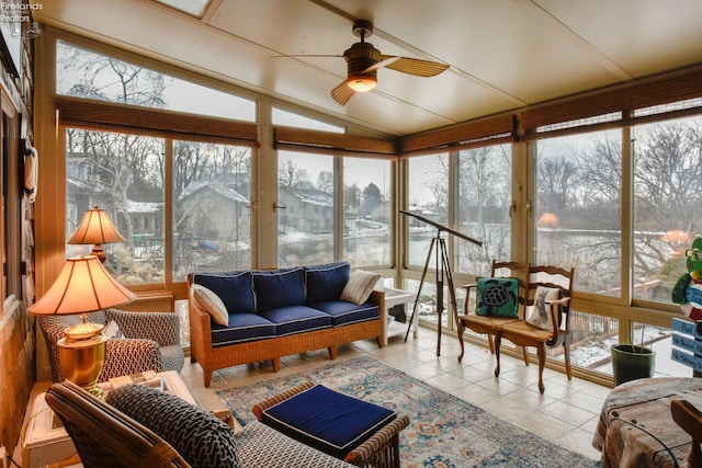 sunroom / solarium with ceiling fan and lofted ceiling