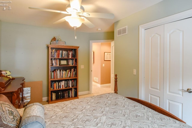 bedroom with ceiling fan and a closet