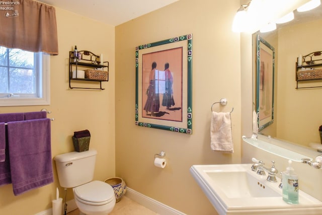 bathroom with toilet and sink