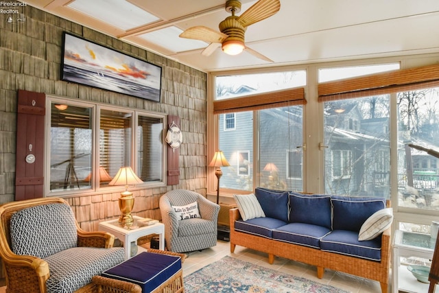 sunroom with ceiling fan