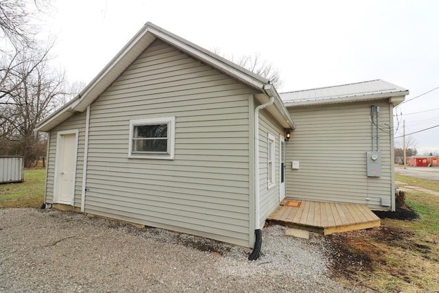 rear view of house featuring a deck