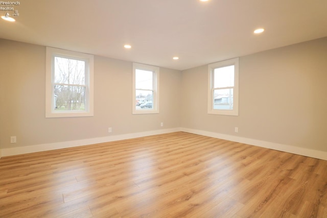 empty room with light hardwood / wood-style floors