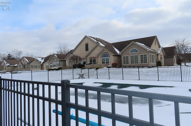 view of snow covered pool