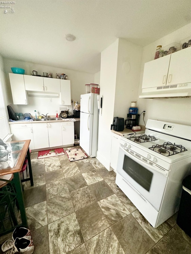 kitchen featuring white cabinets, a textured ceiling, white appliances, and sink