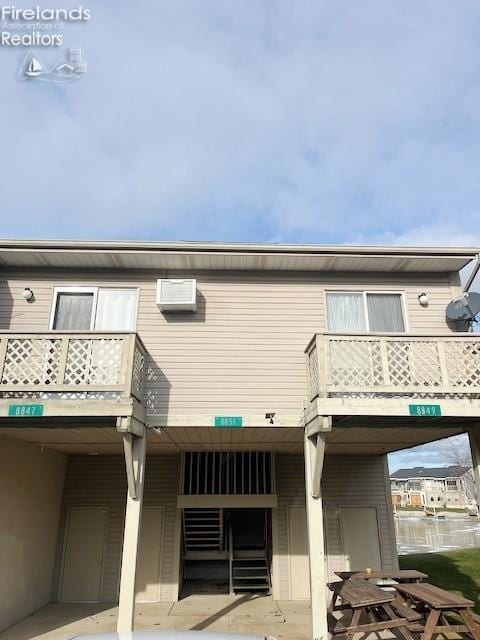 rear view of property featuring a patio area