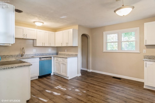 kitchen with white cabinetry, dark wood-type flooring, stainless steel dishwasher, and light stone counters