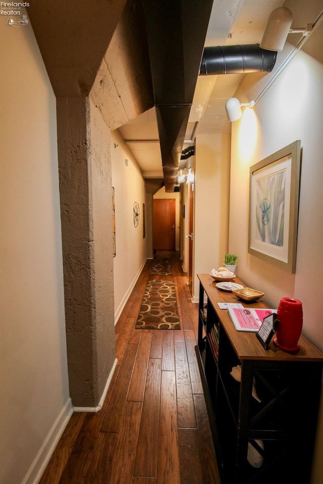 corridor featuring dark hardwood / wood-style flooring