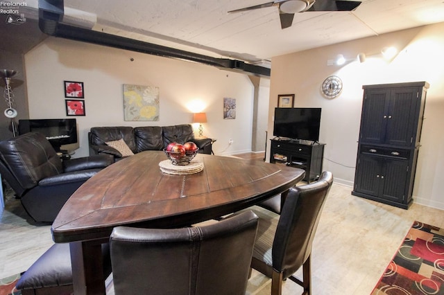 dining space with ceiling fan and light hardwood / wood-style flooring