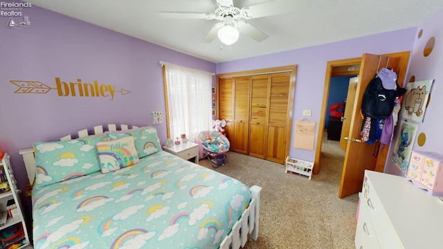 carpeted bedroom featuring a closet and ceiling fan