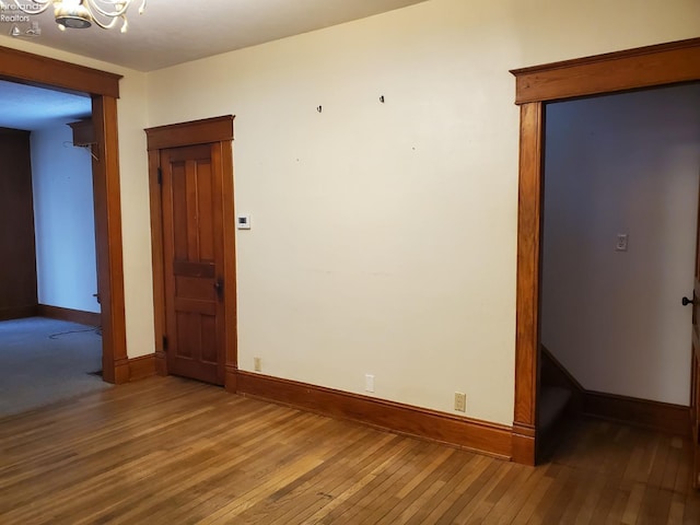 unfurnished room featuring hardwood / wood-style flooring