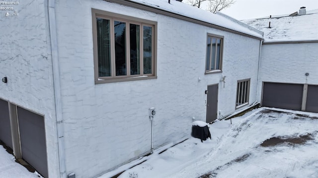 view of snow covered property