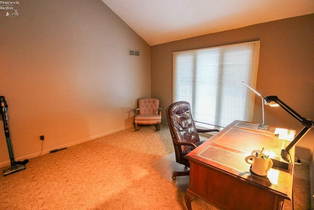 office space featuring light colored carpet and lofted ceiling