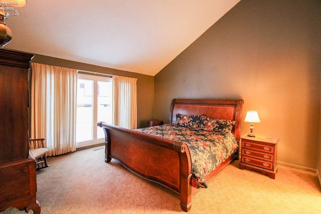 carpeted bedroom featuring vaulted ceiling