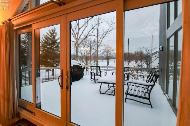 entryway with french doors, carpet floors, and a healthy amount of sunlight