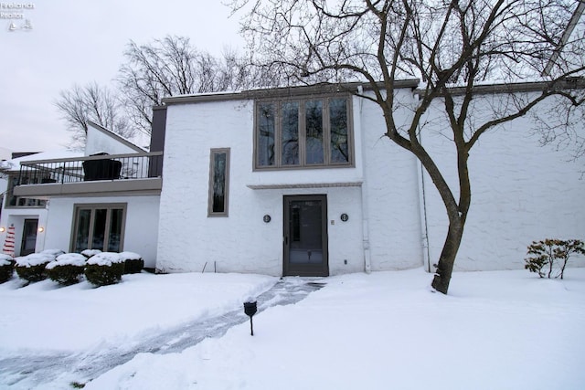 view of front of home with a balcony