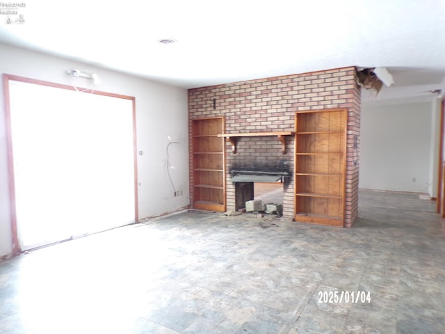 unfurnished living room with a fireplace