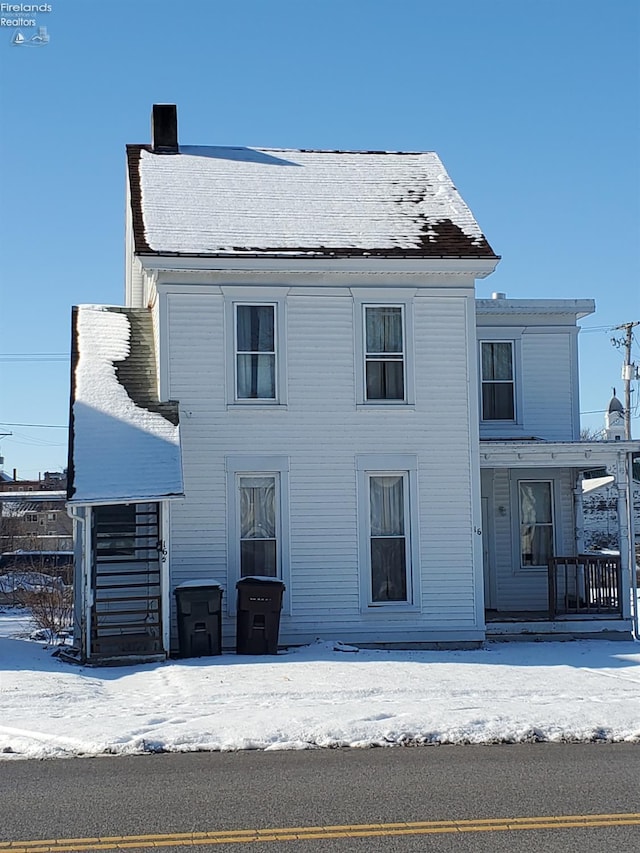 view of snow covered property