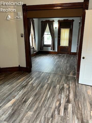 empty room featuring dark hardwood / wood-style flooring