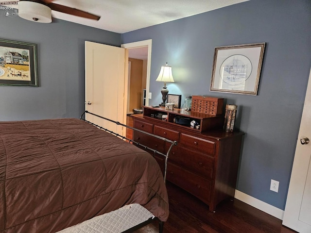 bedroom featuring dark hardwood / wood-style flooring and ceiling fan