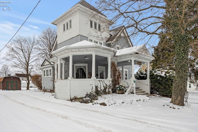 view of front of home with an outbuilding and a porch