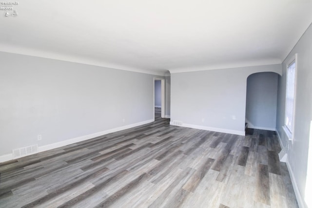 empty room with dark hardwood / wood-style floors