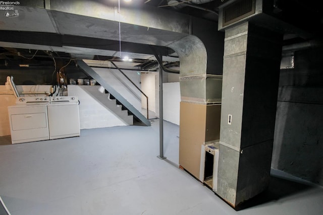 basement featuring washing machine and clothes dryer