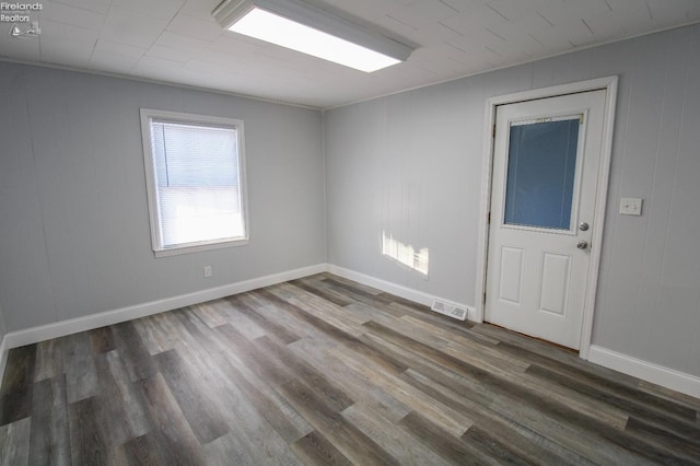 unfurnished room featuring dark hardwood / wood-style floors