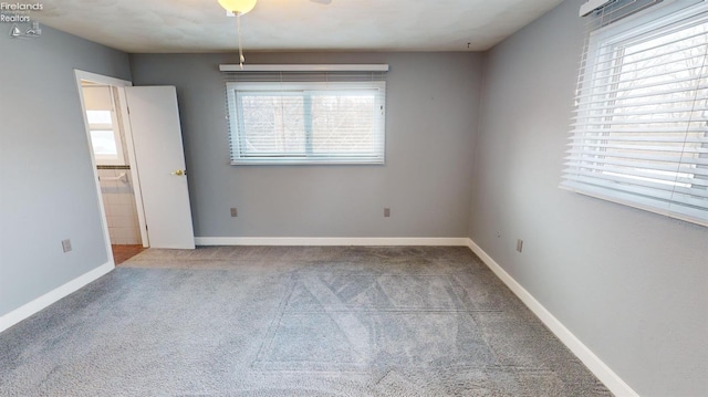 empty room with light colored carpet