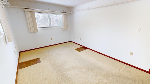 unfurnished room with carpet flooring