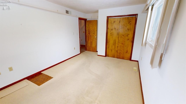 unfurnished bedroom featuring carpet floors