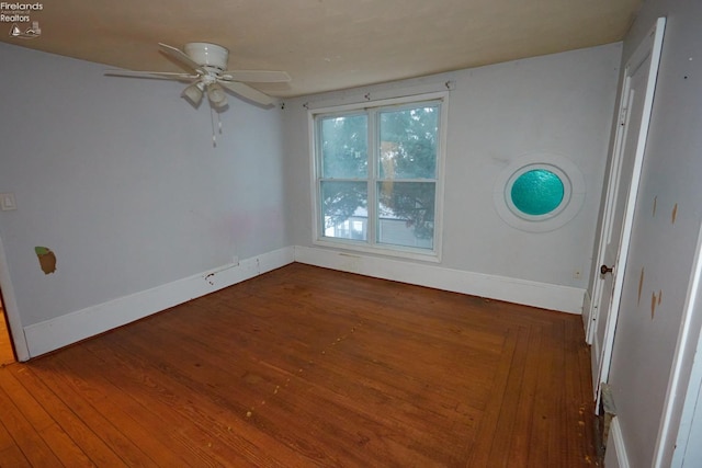 spare room with ceiling fan and hardwood / wood-style floors