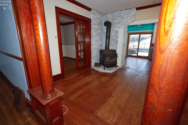 hall featuring hardwood / wood-style floors and a textured ceiling