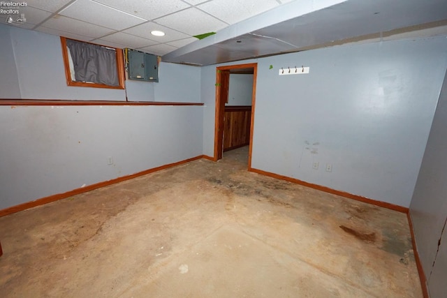 basement featuring a paneled ceiling