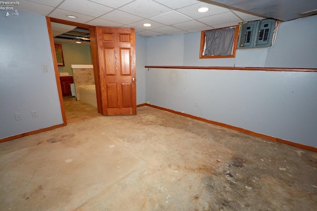 basement featuring a drop ceiling