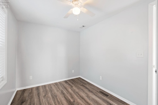 spare room featuring hardwood / wood-style flooring and ceiling fan