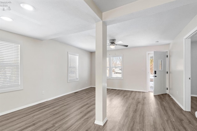 interior space featuring ceiling fan and dark hardwood / wood-style floors