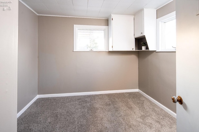 washroom featuring crown molding and light carpet